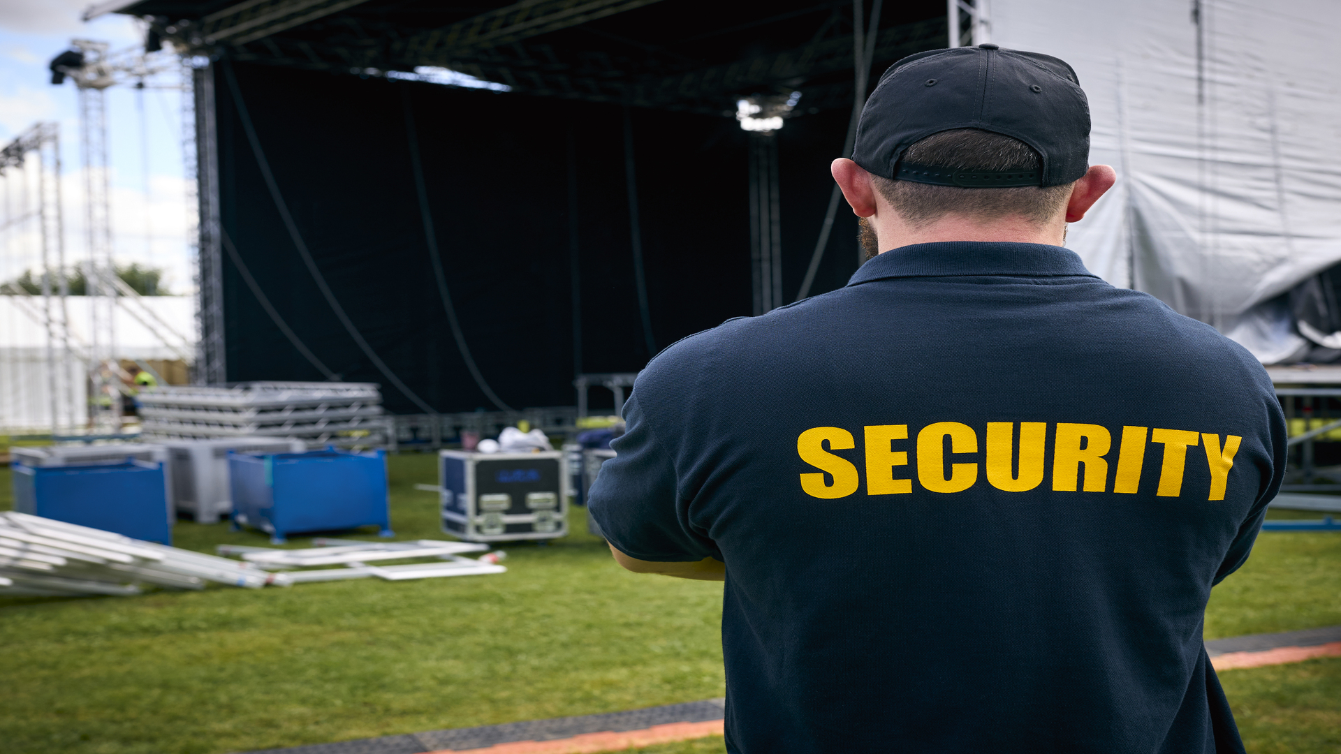 rear-view-of-security-team-at-outdoor-stage-for-mu-2024-10-21-02-11-31-utc